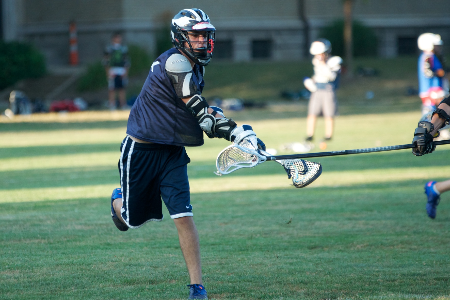 Boys lacrosse camp drill